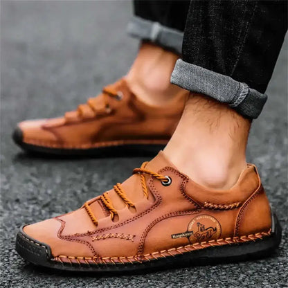 Elegant men's ankle boots by Jungle Line featuring leopard print, lacing, and anti-slip soles for stylish safety.