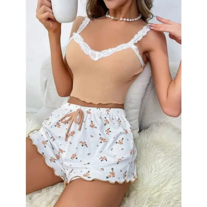 Women’s pink lace patchwork pajama set with V-neck top and matching pants, by Jungle Line.
