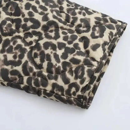 Lightweight quilted women's jacket by Jungle Line featuring a padded, leopard print design perfect for autumn and winter outerwear.