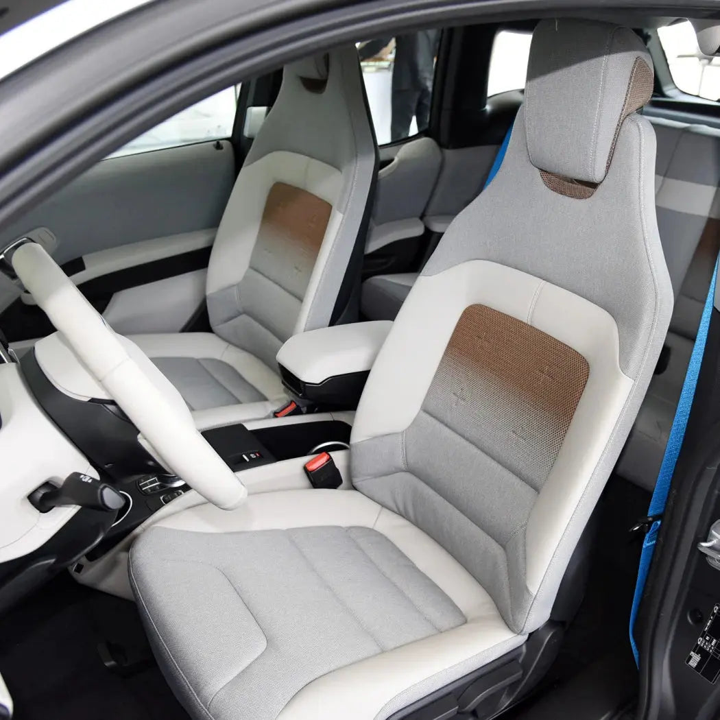 Full set of Jungle Line custom fitted faux leather car seat covers showing seat and backrest protection in black.