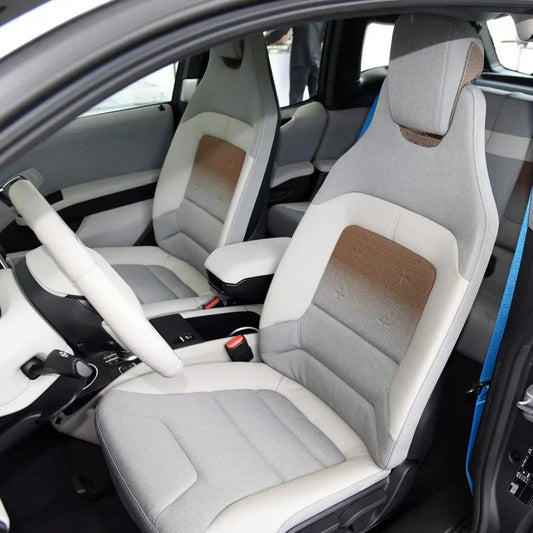 Full set of Jungle Line custom fitted faux leather car seat covers showing seat and backrest protection in black.