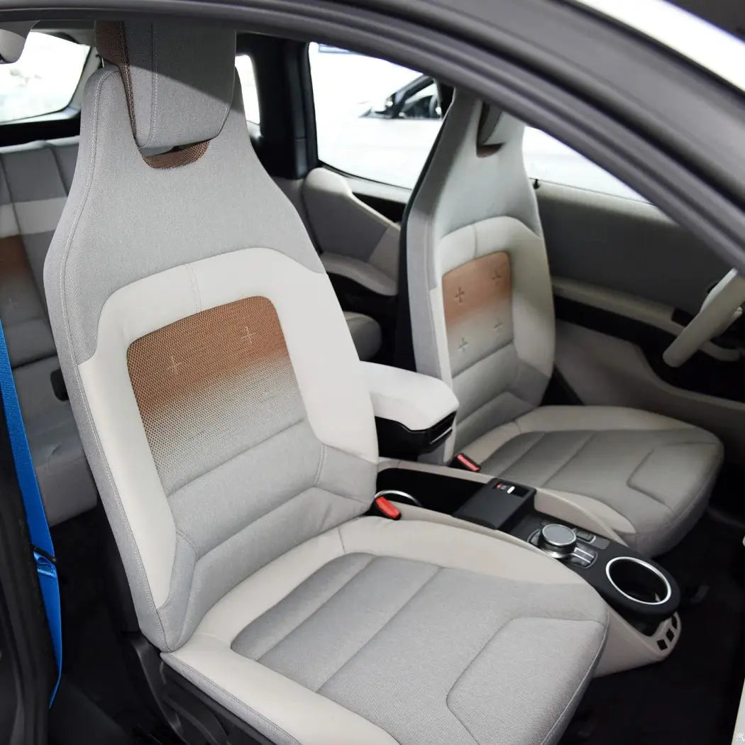 Full set of Jungle Line custom fitted faux leather car seat covers showing detailed stitching and plush texture for front and back seats.