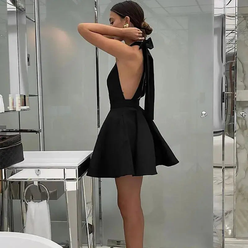 Black Jungle Line backless halter mini dress for women, sleeveless French style evening dress with pockets, perfect for parties.