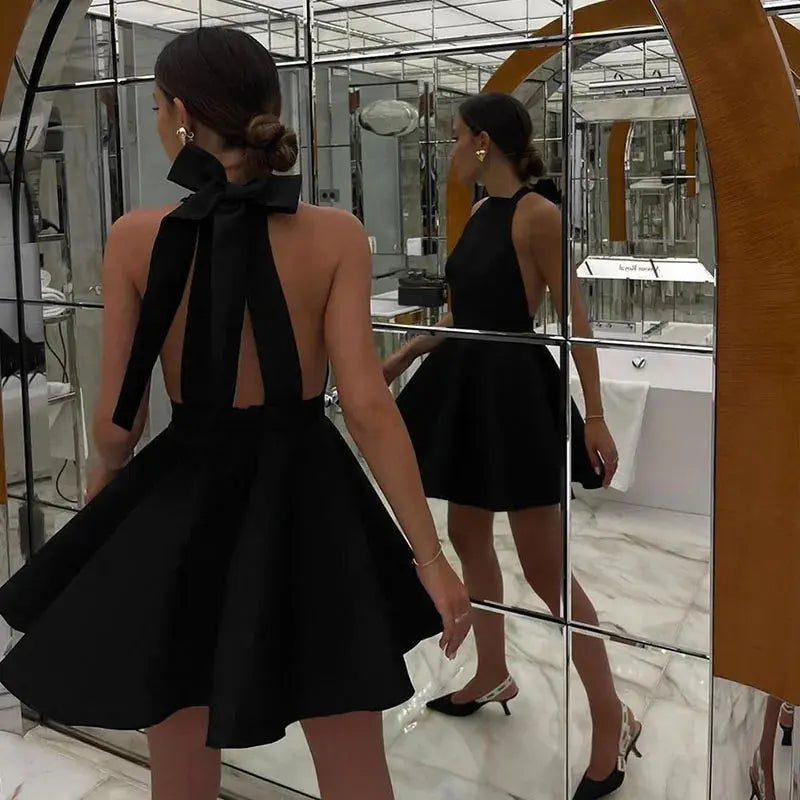 Black Jungle Line backless halter mini dress for women, French style sleeveless short dress with pockets, perfect for evening parties.