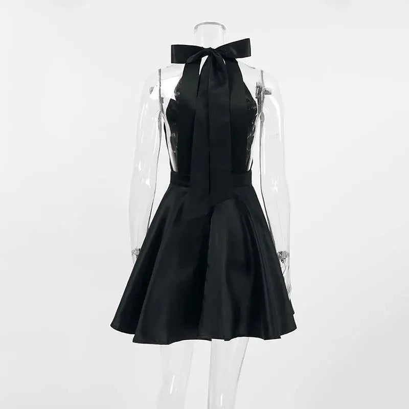 Black Jungle Line backless halter mini dress for women, sleeveless French style with pockets, ideal for evening parties and special occasions.