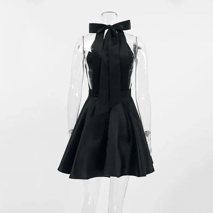 Black Jungle Line backless halter mini dress for women, sleeveless French style with pockets, ideal for evening parties and special occasions.