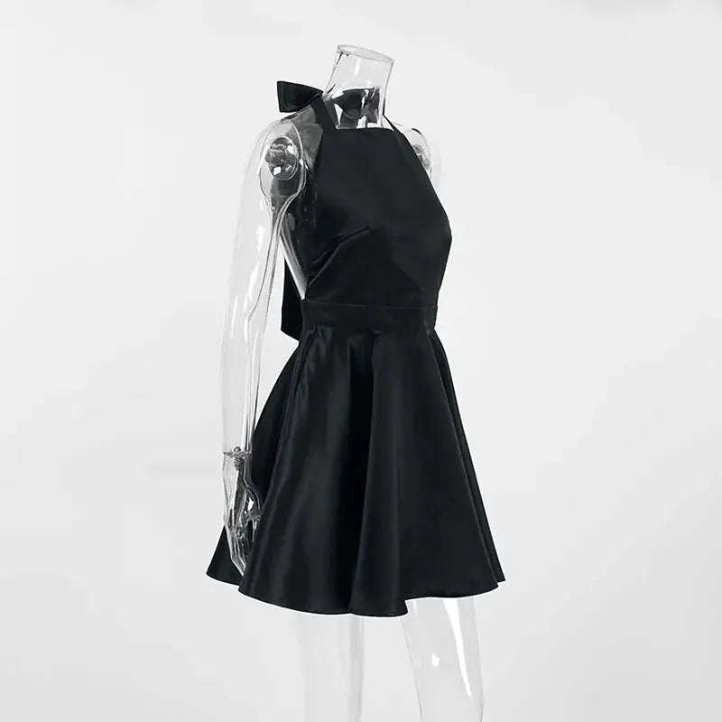 Black Jungle Line backless halter mini dress for women, sleeveless French style evening dress with pockets and elegant design.