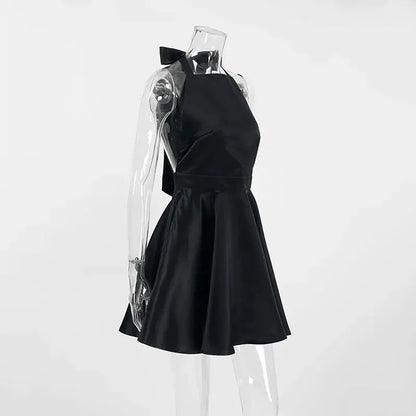 Black Jungle Line backless halter mini dress for women, sleeveless French style evening dress with pockets and elegant design.