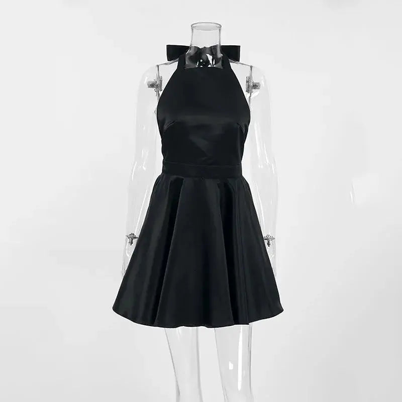 Black Jungle Line backless halter mini dress for women, sleeveless French style short dress with pockets, perfect for evening parties.