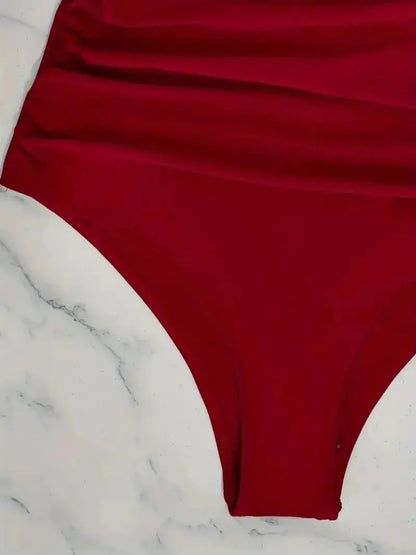 Maillot de bain une pièce noir Jungle Line avec mesh contrast, col en V, dos nu, contrôle du ventre et coupe haute.