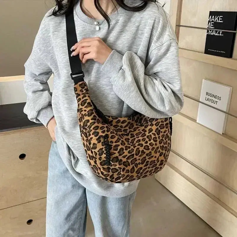 Leopard print crossbody bag for women by Jungle Line, made of corduroy, with brown and black spots, 36cm by 21cm by 7cm.