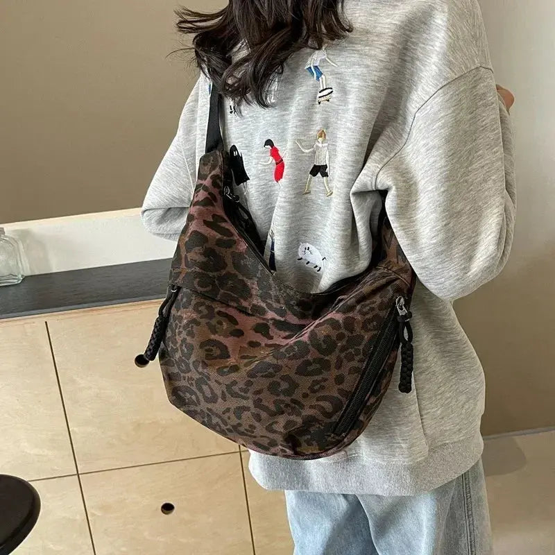 Leopard print crossbody bag for women made of corduroy by Jungle Line, brown with adjustable strap and stylish design.
