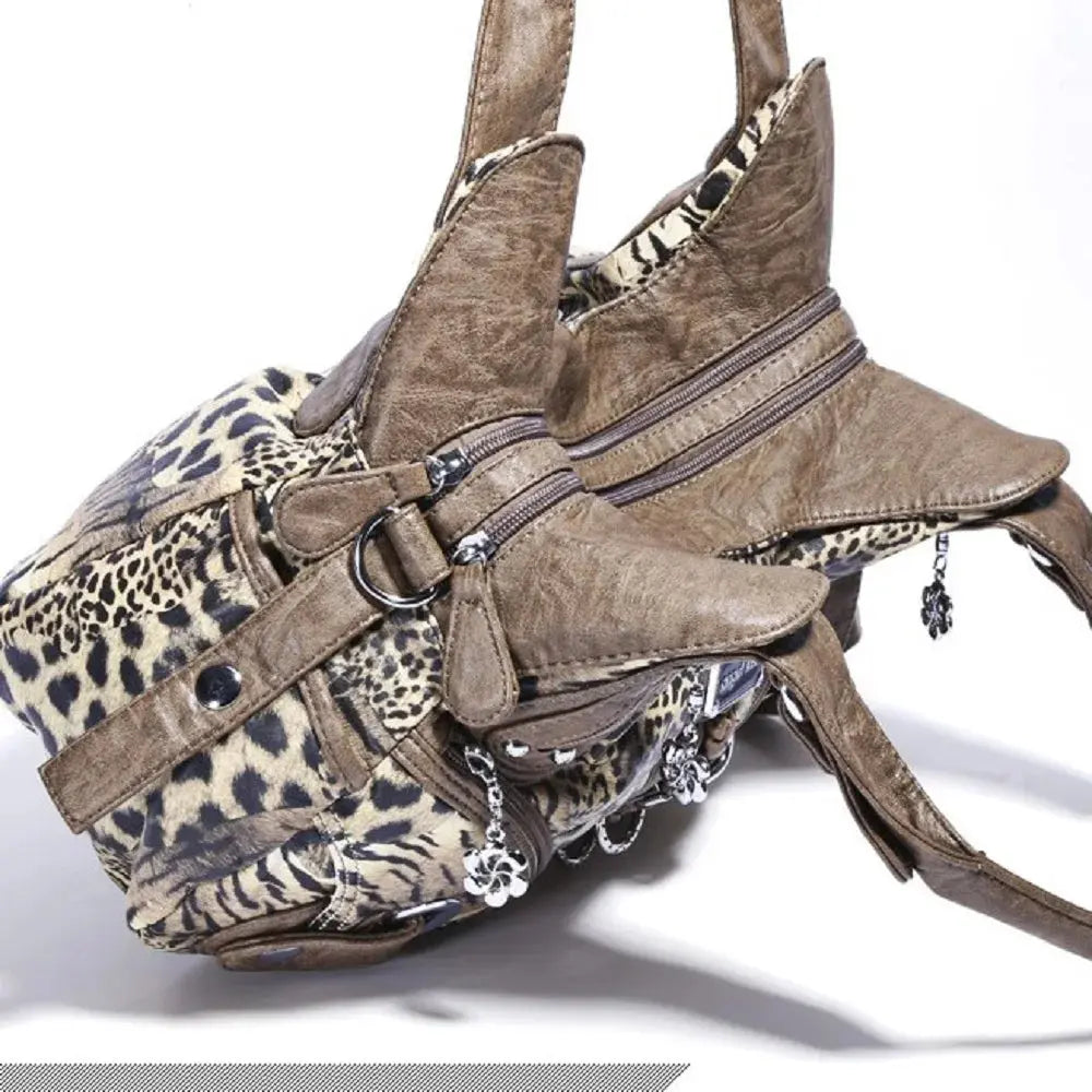 Angelkiss Leopard Shoulder Bag by Jungle Line, brown faux leather handbag with top handle, large tote style, and fashionable dumpling shape.