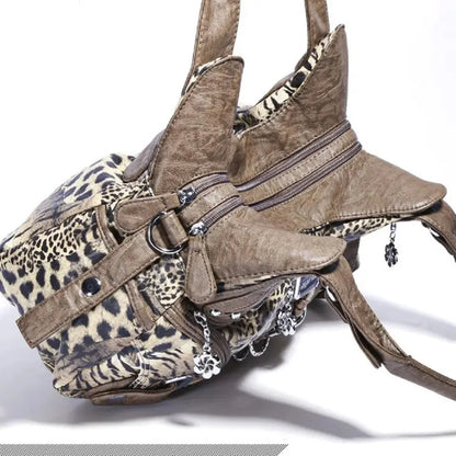 Angelkiss Leopard Shoulder Bag by Jungle Line, brown faux leather handbag with top handle, large tote style, and fashionable dumpling shape.