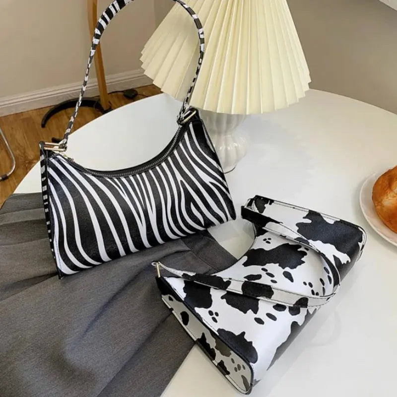 Sac à main pour femmes en cuir PU avec motif zèbre et léopard, de la marque Jungle Line, style tendance et élégant.