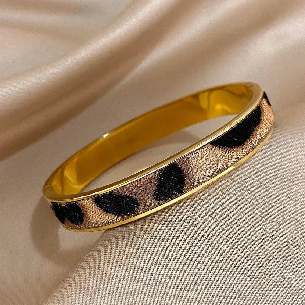 Gold-colored Leopard Print Welt Women's Bracelet by Jungle Line featuring a stylish leopard pattern and woven design.