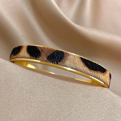 Gold leopard print Welt women's bracelet by Jungle Line featuring a stylish and bold design with a gold-colored finish.