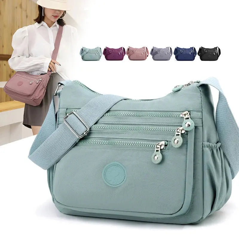 Dark blue Jungle Line women's messenger shoulder bag with large capacity, featuring multiple compartments and a stylish design.
