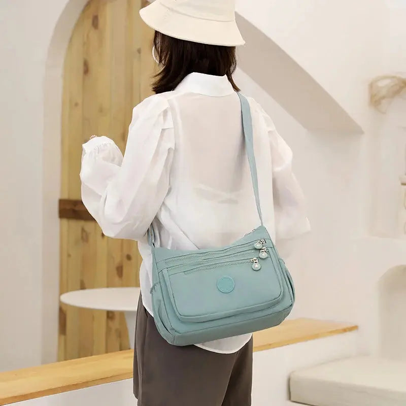 Dark blue women's messenger shoulder bag by Jungle Line, featuring a large capacity and stylish design for everyday use.