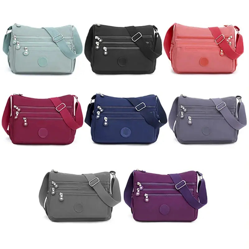 Dark blue women's messenger shoulder bag by Jungle Line with large capacity and multiple compartments.