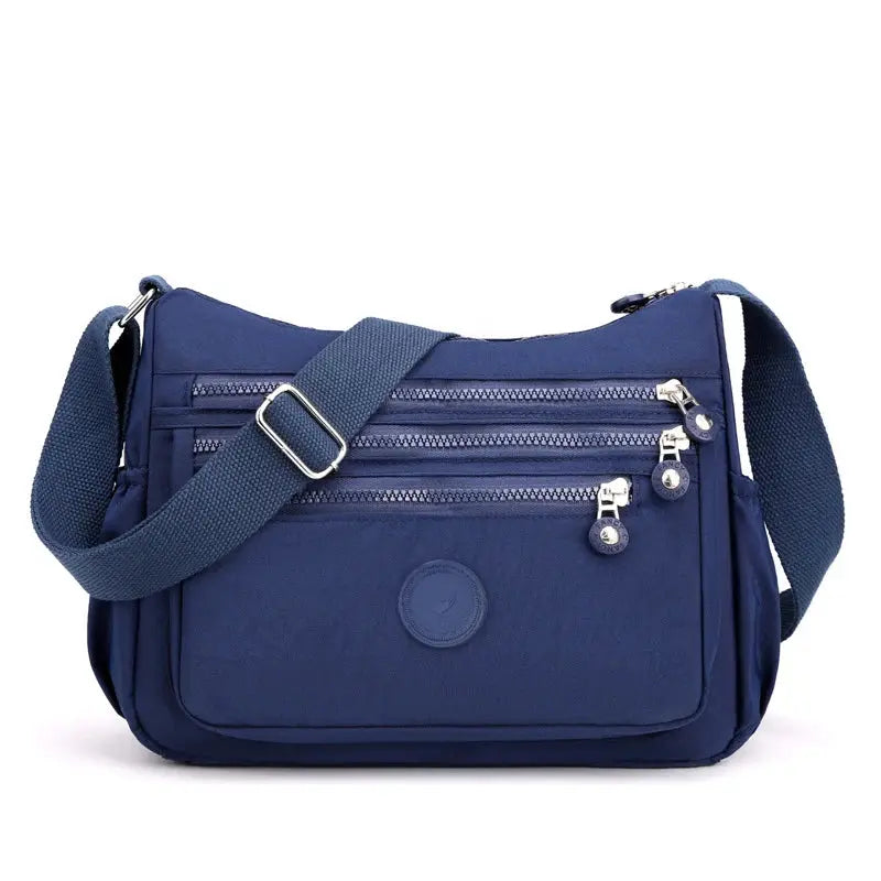 Dark blue Women's Messenger Shoulder Bag by Jungle Line, large capacity with adjustable strap and multiple compartments.
