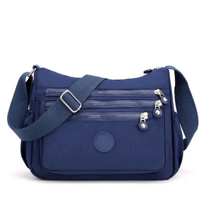 Dark blue Women's Messenger Shoulder Bag by Jungle Line, large capacity with adjustable strap and multiple compartments.