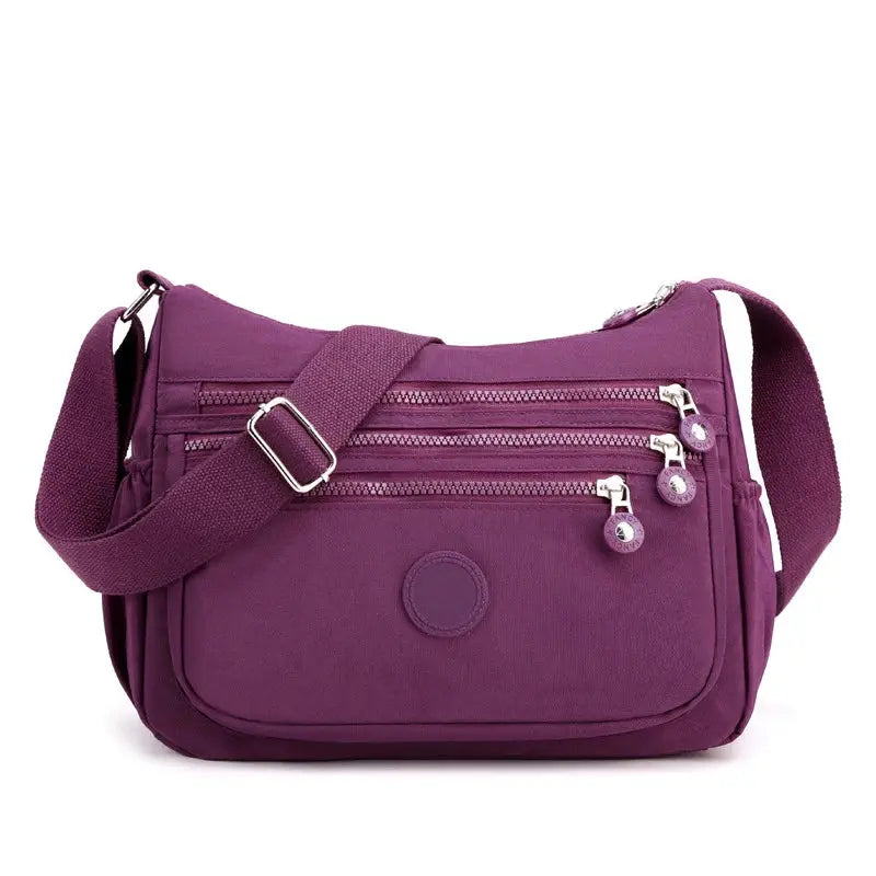 Dark blue women's messenger shoulder bag by Jungle Line, large capacity with multiple compartments for everyday use.