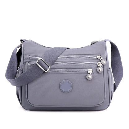 Dark blue Jungle Line women's messenger shoulder bag with large capacity, featuring adjustable strap and multiple compartments.