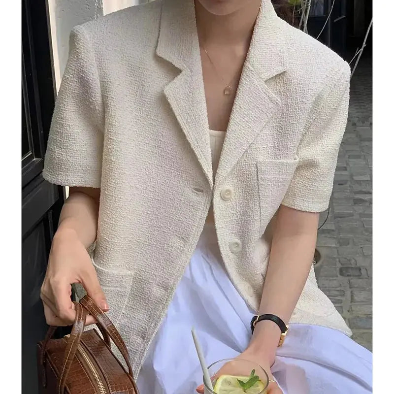 Jungle Line women's Korean style suit jacket with lapel, single-breasted design, multiple pockets, short sleeves, loose fit for summer.