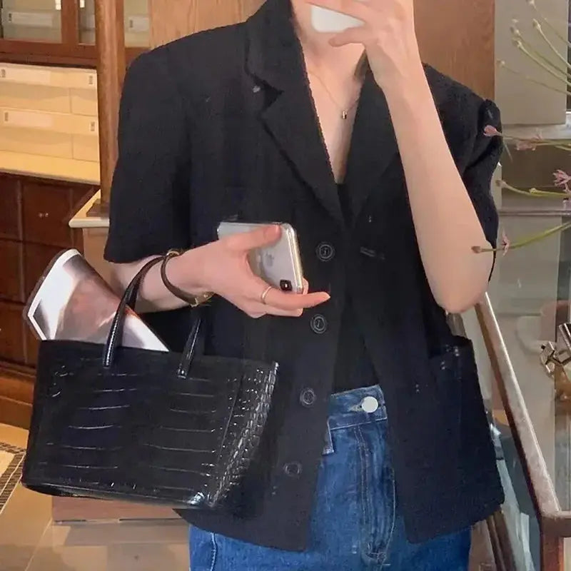 Chic women's Korean style suit jacket by Jungle Line, single-breasted, lapel, multiple pockets, short sleeves, loose fit, summer fashion.
