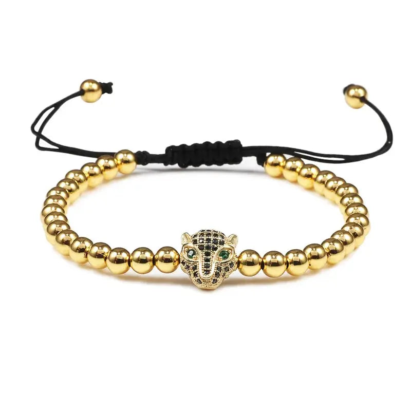 Bracelet Jungle Line avec charms tête de léopard en cuivre de 5 mm, perles noires et détails raffinés.