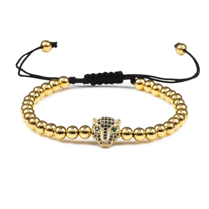 Bracelet Jungle Line avec charms tête de léopard en cuivre de 5 mm, perles noires et détails raffinés.