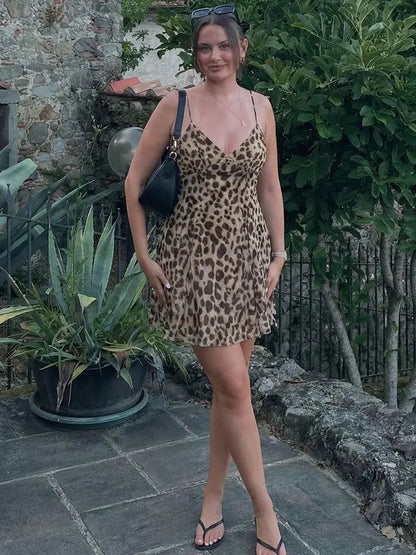 Robe courte femme Jungle Line à imprimé léopard, sans manches, décolleté en V, dos nu, idéale pour l'été et la plage.