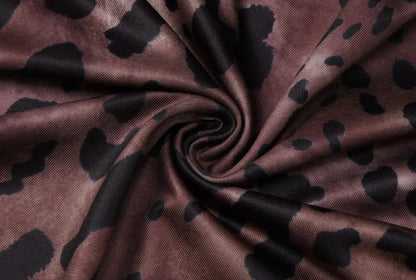 Robe longue sexy à motif léopard sans dos de Jungle Line, élégante avec décolleté en V profond et design moulant.