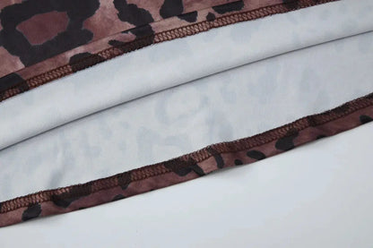 Robe longue sexy sans manches de Jungle Line, imprimé léopard, dos nu, décolleté en V profond, style bodycon élégant pour femme.