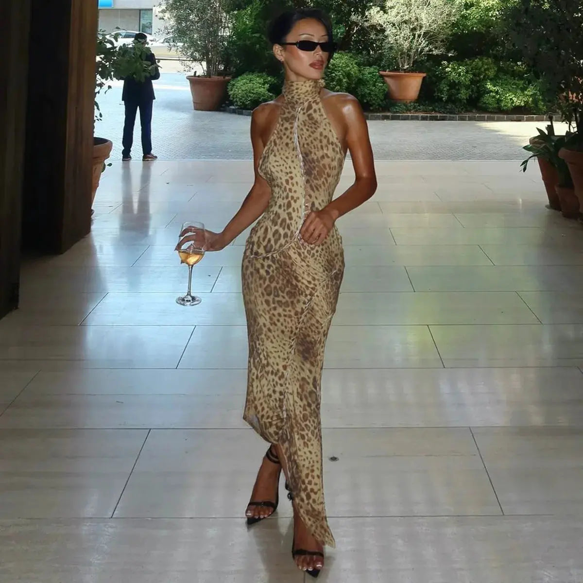 Jungle Line leopard print backless halter maxi dress for women, bandage style with embellishments, perfect for club or party wear.