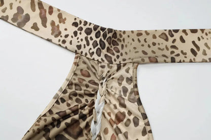 Jungle Line leopard print halter backless maxi dress for women, with bandage embellishments, ideal for club or evening wear.