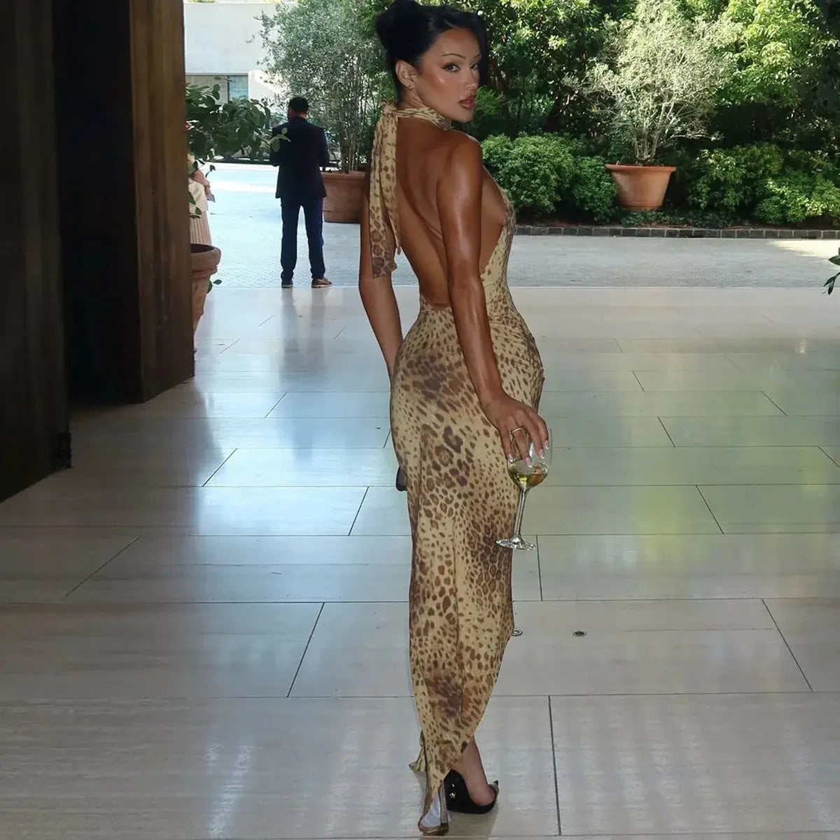 Jungle Line leopard print backless halter maxi dress with bandage details, perfect for clubwear and evening outings.