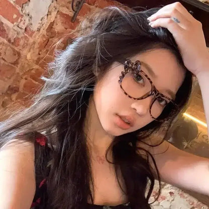 Lunettes vintage à imprimé léopard pour femmes, grand cadre ovale, style Y2K, avec nœud bow, sans lentilles, mode et cartoon.