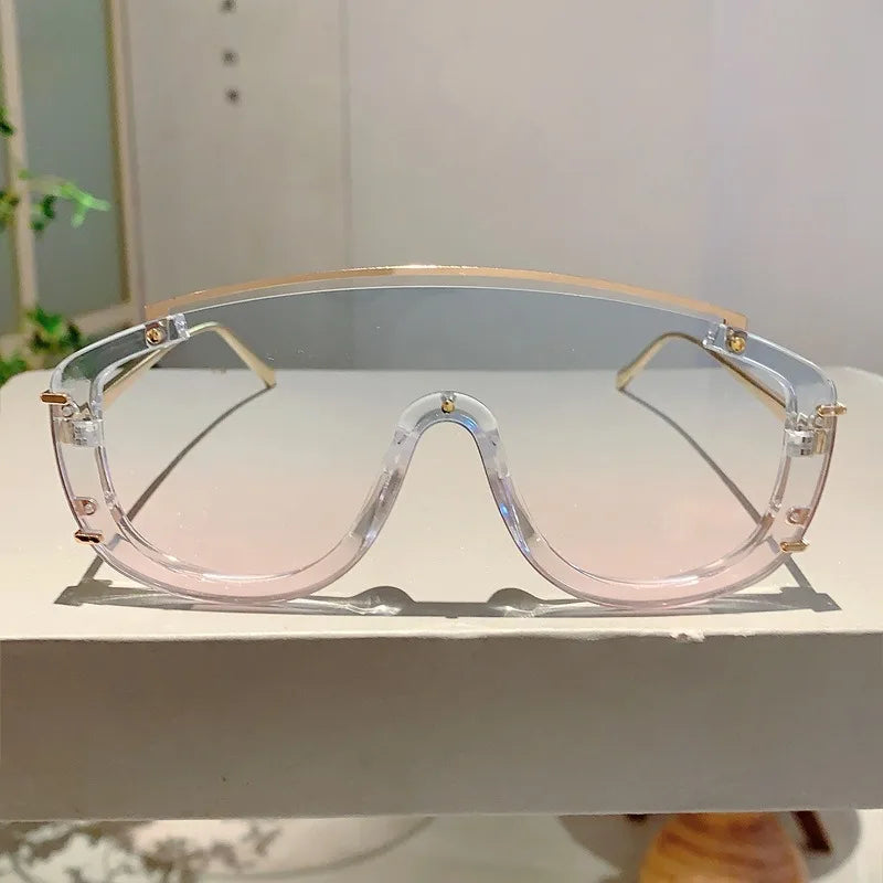 Lunettes de soleil oversize Jungle Line pour femmes et hommes, design en métal luxe, motif léopard orange avec dégradé.