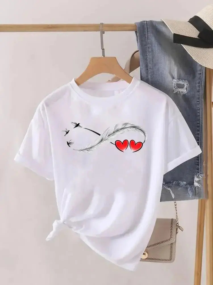 White women's graphic T-shirt by Jungle Line featuring a love heart and feather print, short sleeves, casual fashion top.