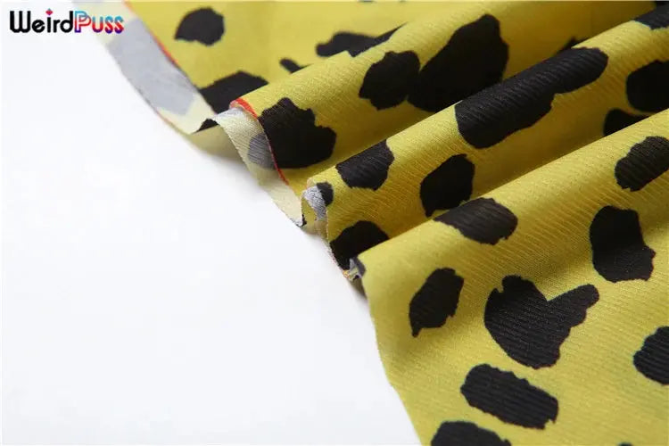 Jungle Line yellow leopard-print halter dress for women, backless chiffon bodycon with irregular hem and patchwork design.